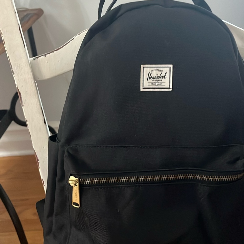 Herschel Black backpack with red inside stripes